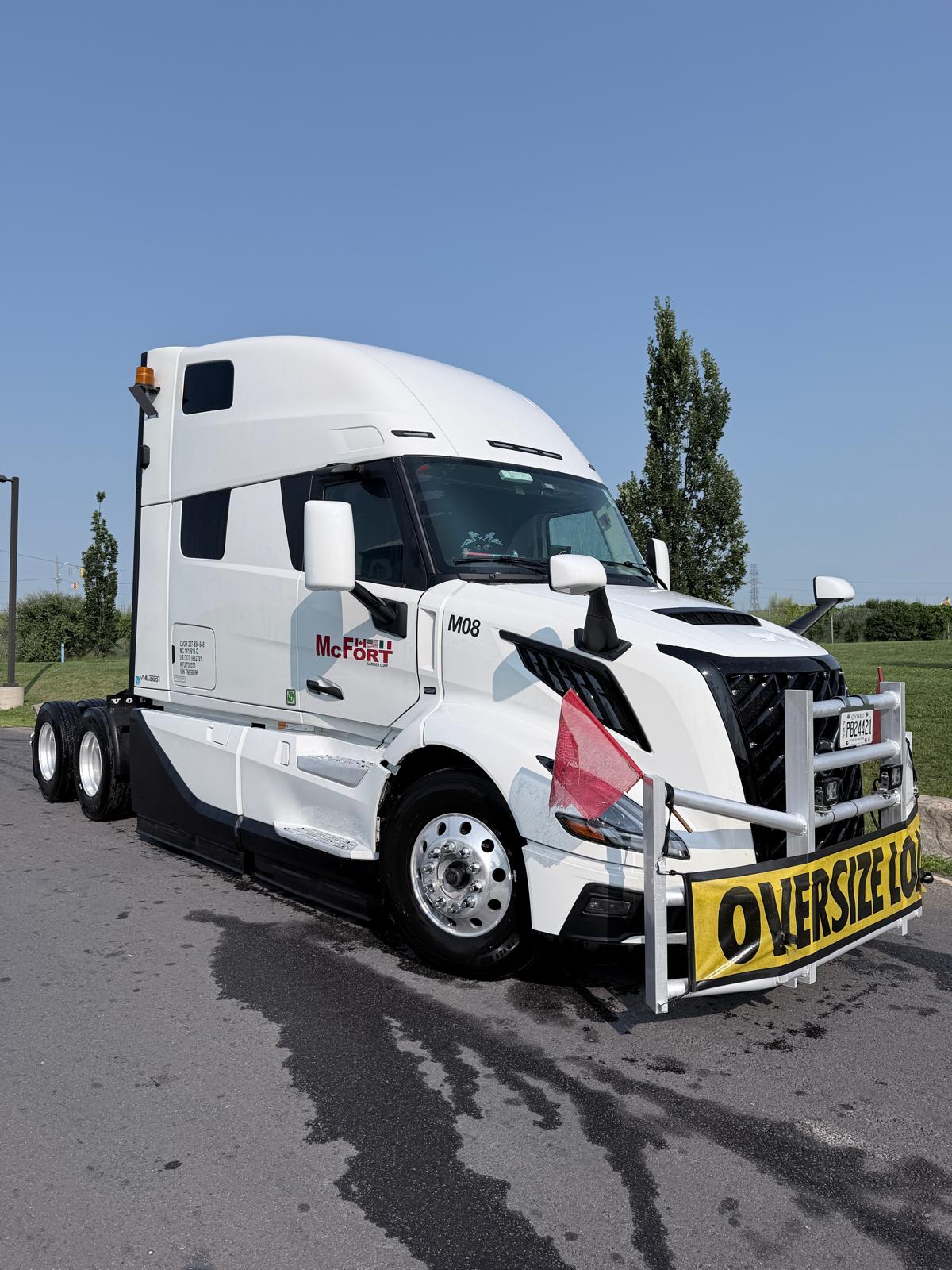 M08 Volvo VNL · oversize load banner